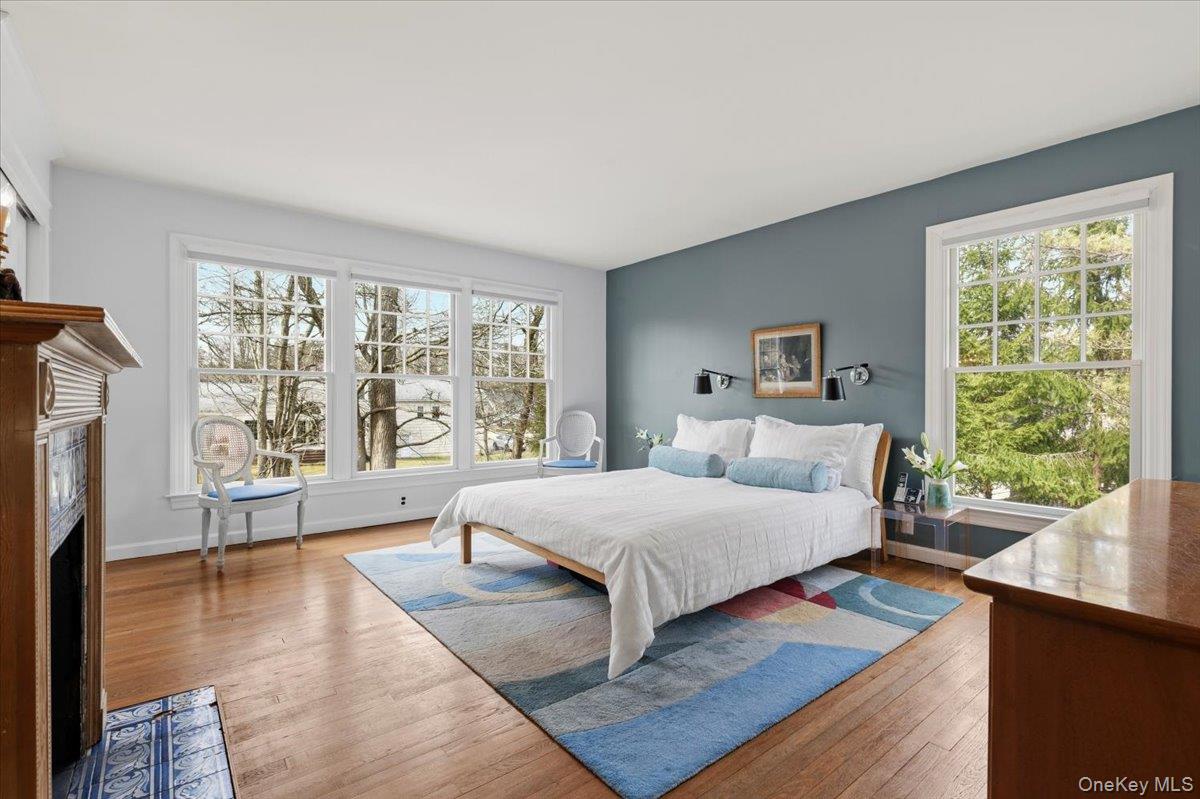 8 Douglas Circle Rye, NY 10580 - Photo 16 of 36 The primary bedroom enjoys an abundance of natural light and afternoon sun.