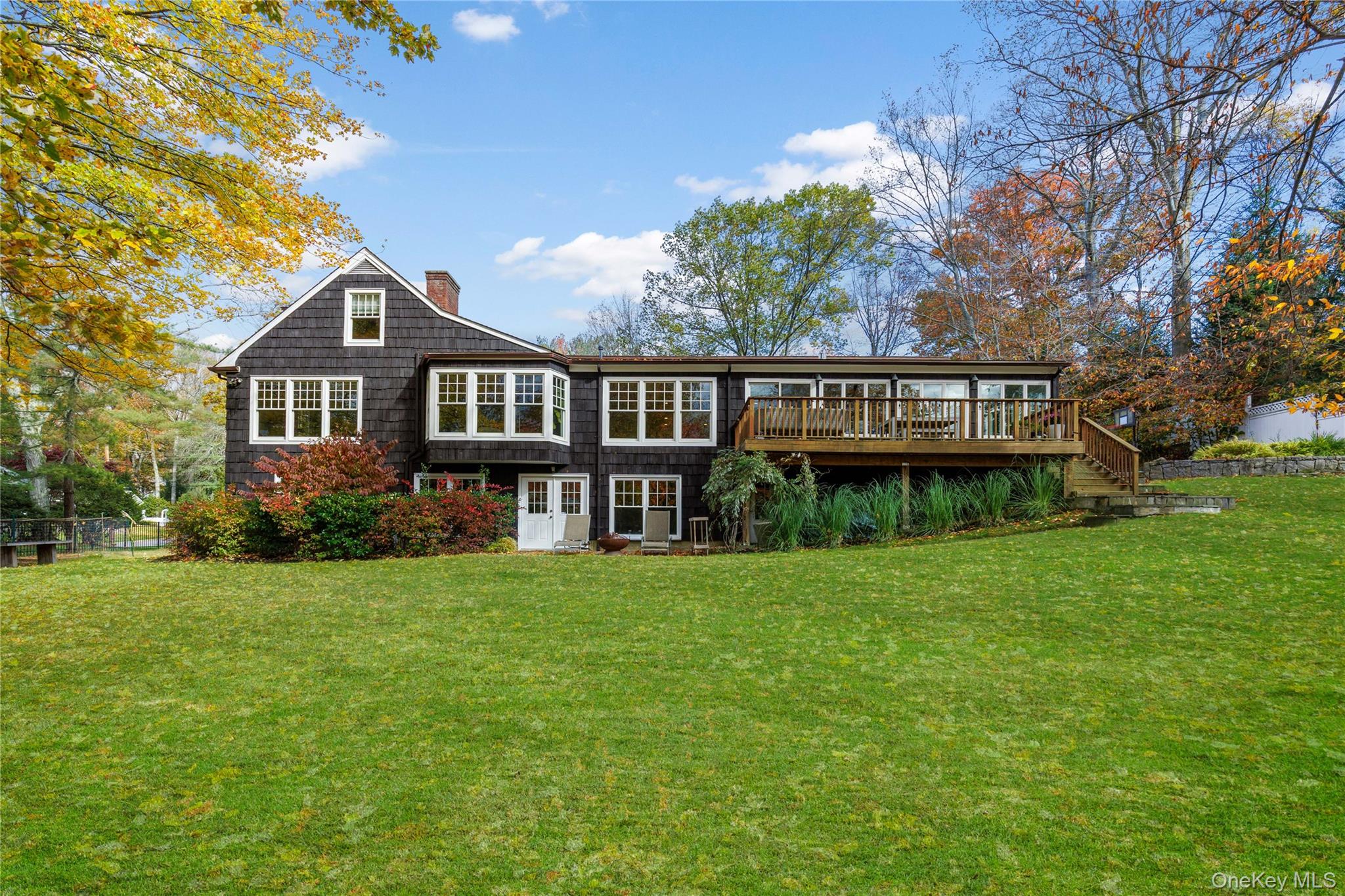 8 Douglas Circle Rye, NY 10580 - Photo 2 of 36 Walls of windows bring the outdoors inside with panoramic views of the seasons.