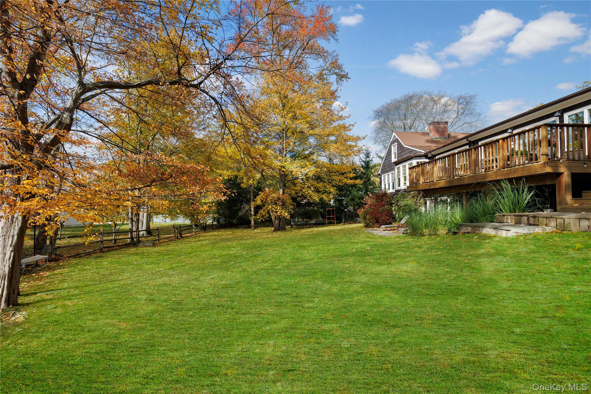 8 Douglas Circle Rye, NY 10580 - Photo 32 of 36 The wood deck overlooks the backyard at tree-canopy height.