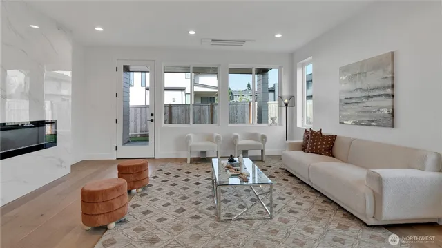 a living room with furniture and a large window