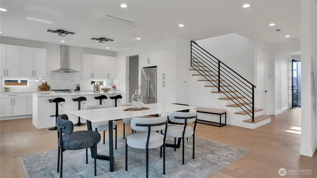 a dining room with furniture and entryway
