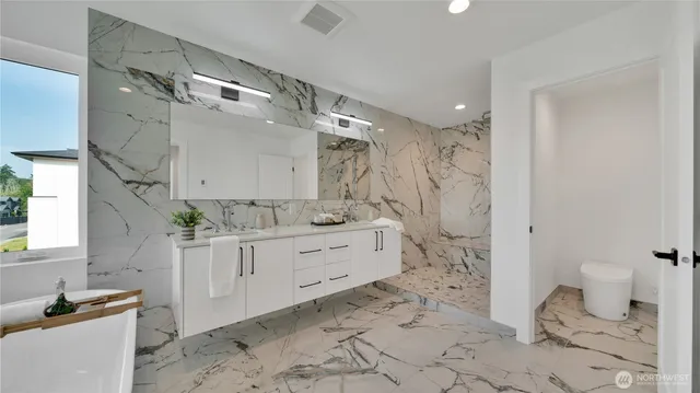 a living room with furniture a window and a chandelier