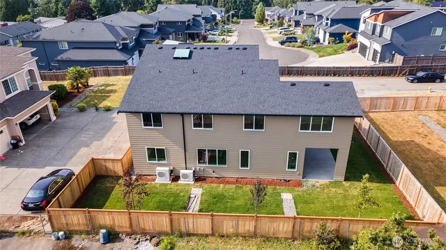 a aerial view of a house with a yard