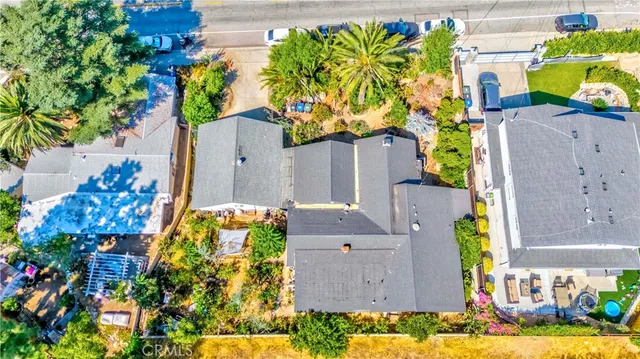 an aerial view of residential houses and outdoor space