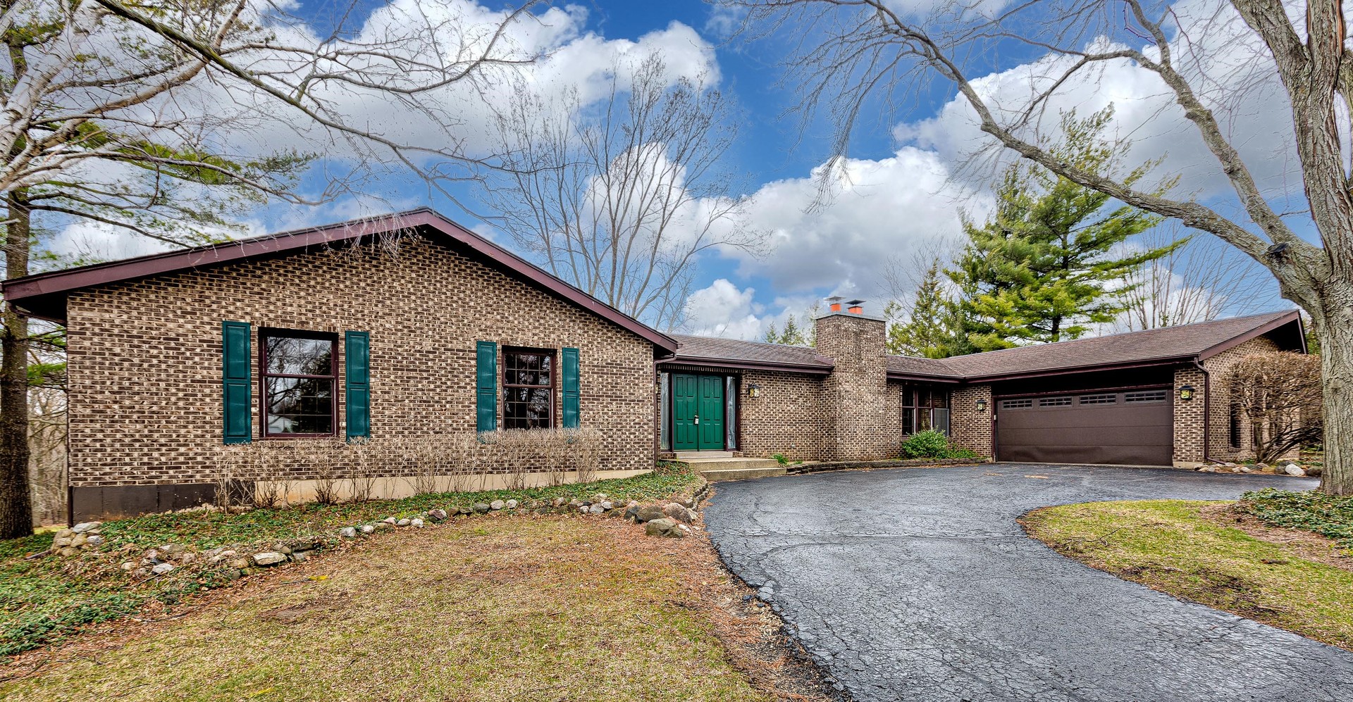 3027 Red Barn Road Crystal Lake, IL 60012 - Photo 1 of 40 a front view of a house with garden