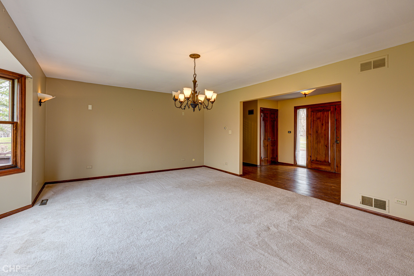 3027 Red Barn Road Crystal Lake, IL 60012 - Photo 13 of 40 a view of a livingroom with a chandelier