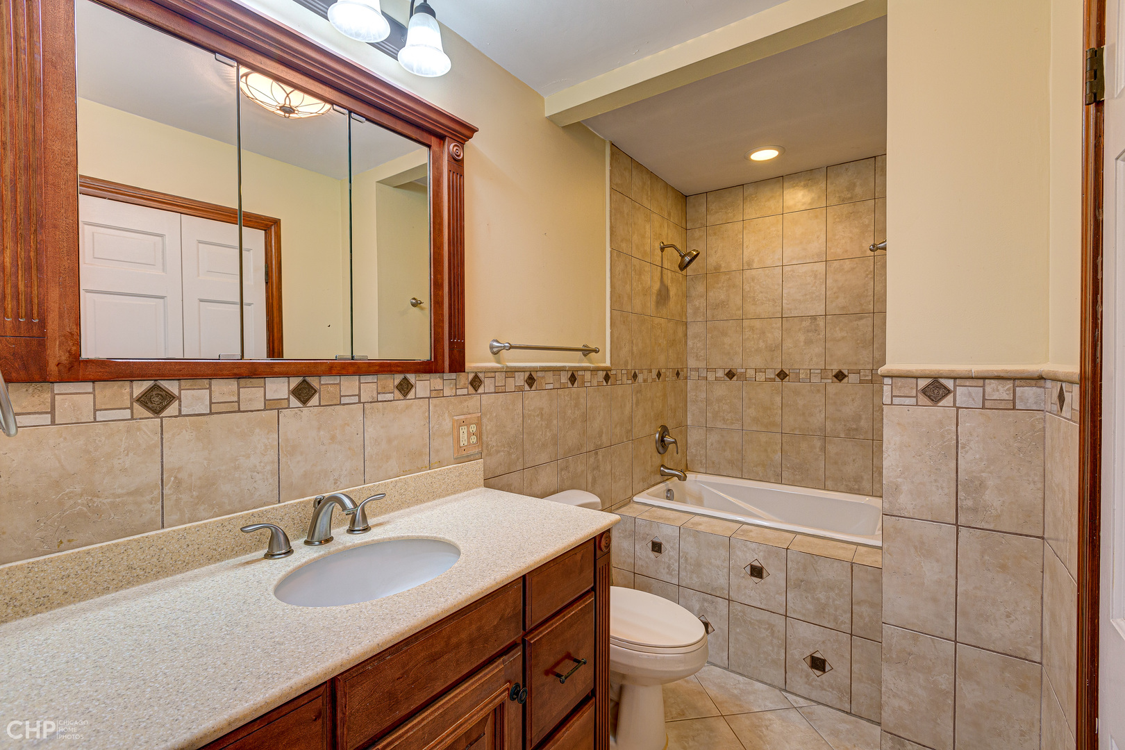 3027 Red Barn Road Crystal Lake, IL 60012 - Photo 20 of 40 a bathroom with a sink double vanity and a shower