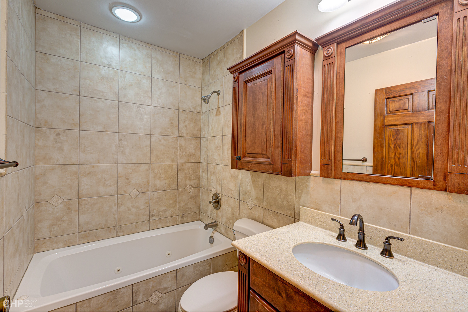 3027 Red Barn Road Crystal Lake, IL 60012 - Photo 21 of 40 a bathroom with a sink toilet a bathtub and shower