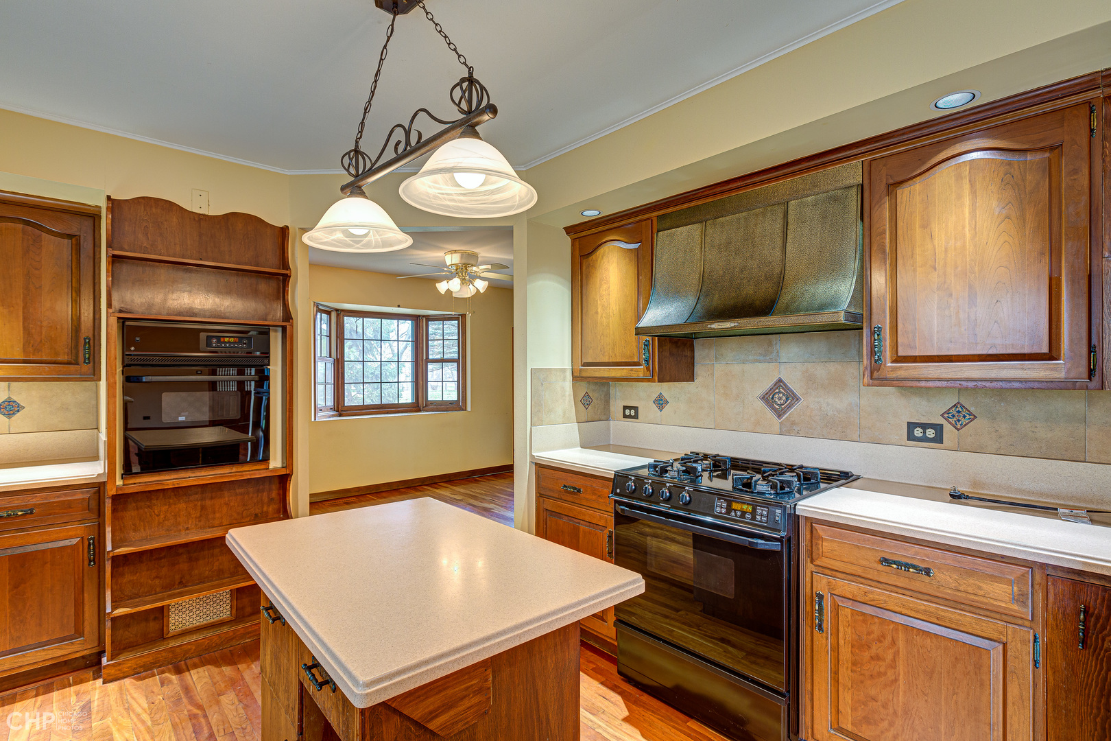 3027 Red Barn Road Crystal Lake, IL 60012 - Photo 4 of 40 a kitchen with stainless steel appliances granite countertop a stove a sink and a microwave