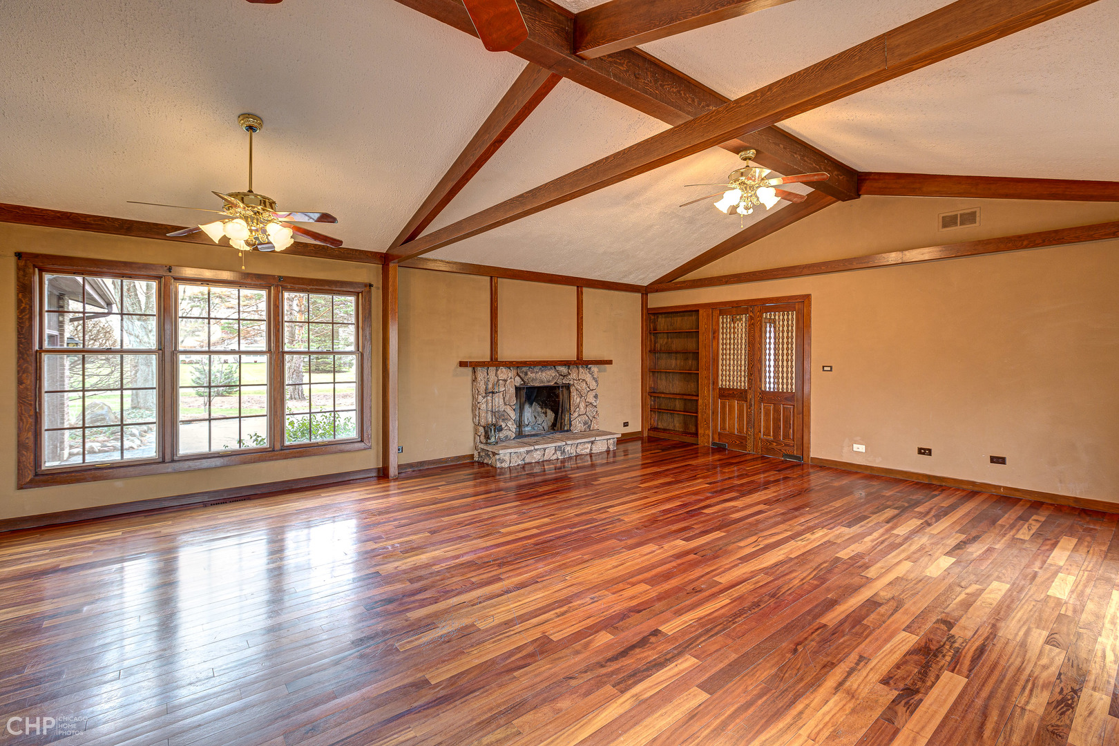3027 Red Barn Road Crystal Lake, IL 60012 - Photo 8 of 40 a view of empty room with wooden floor and fan