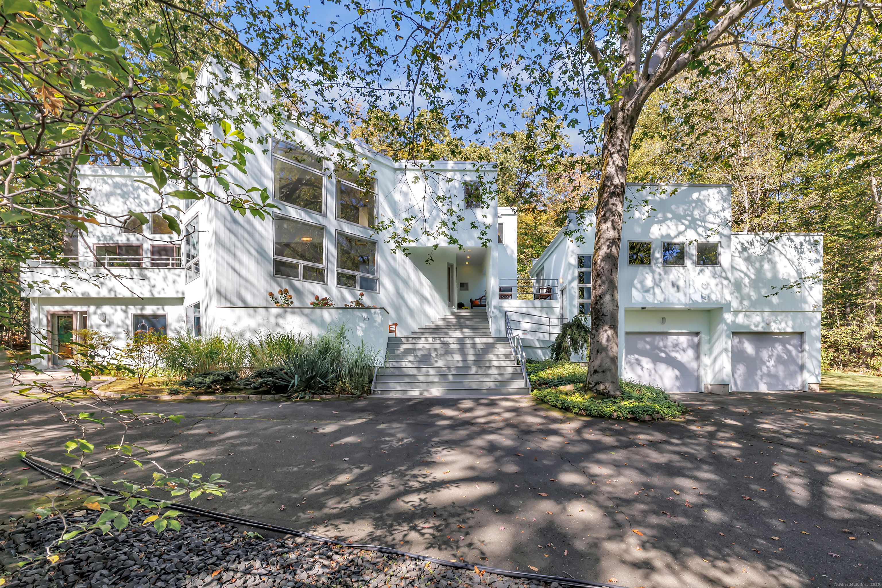 a view of a street with houses on both side