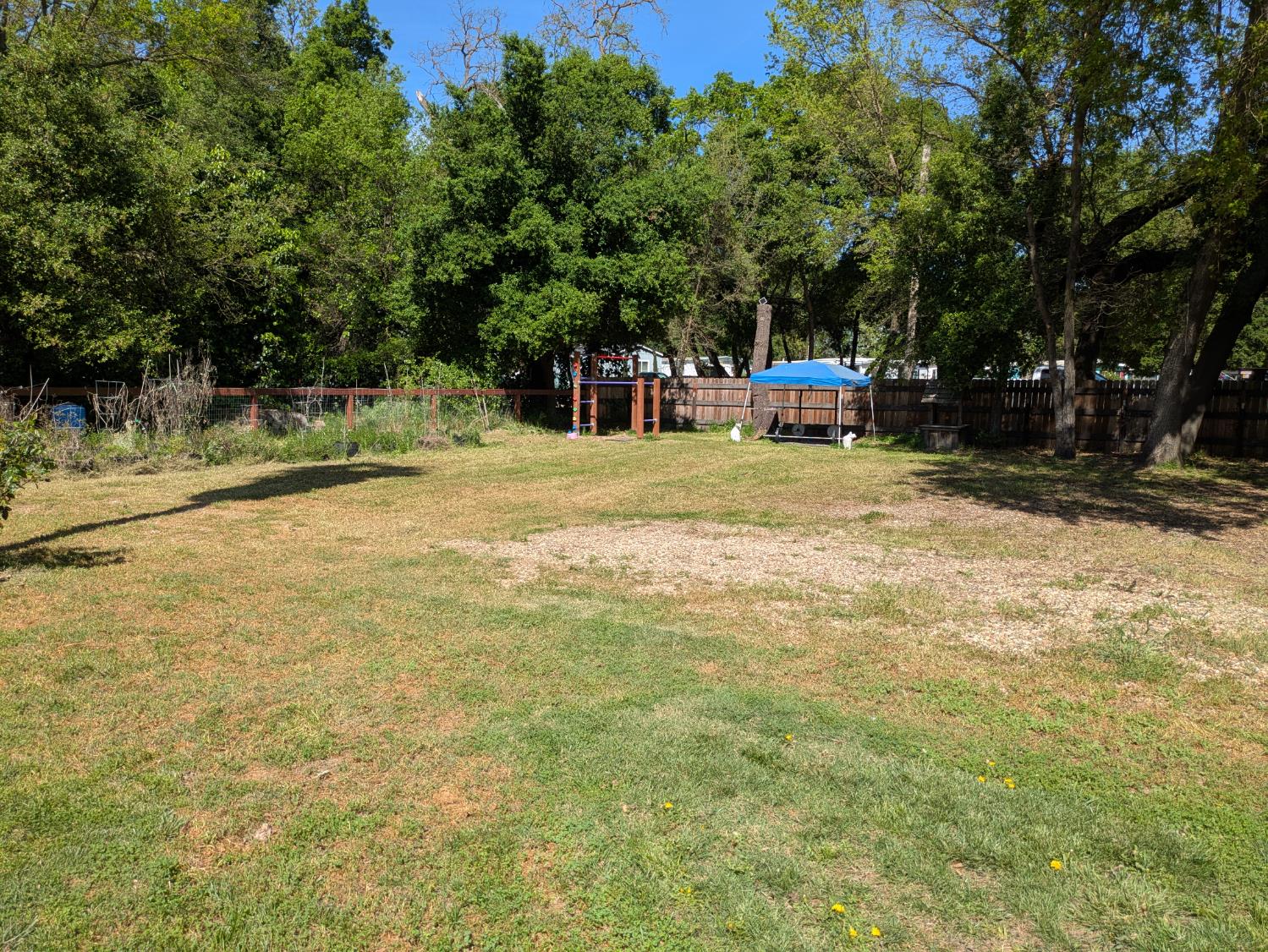 25931 Thornton Road Thornton, CA 95686 - Photo 28 of 31 a backyard of a house with table and chairs