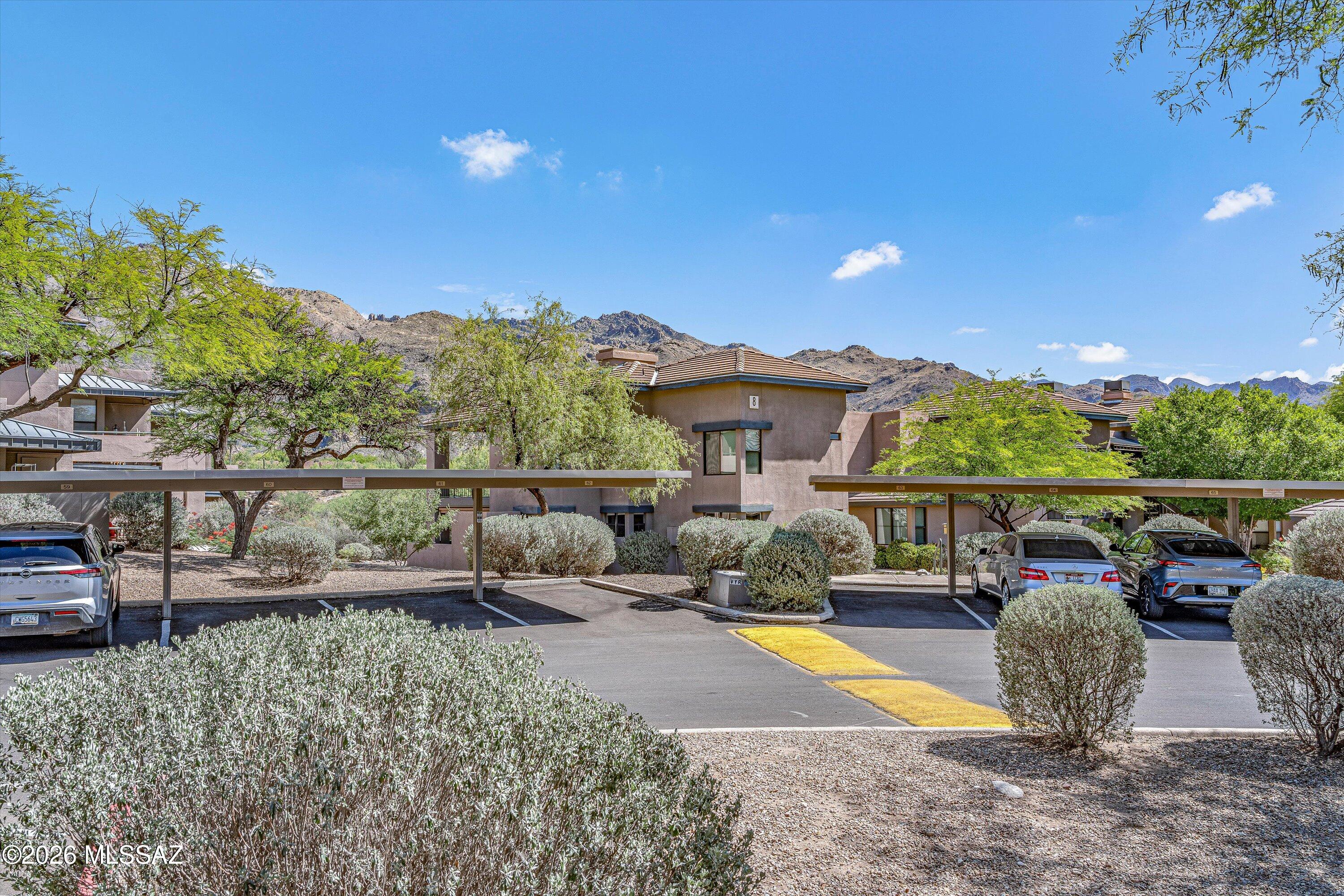 5800 North Kolb Road, Unit 1102 Tucson, AZ 85750 - Photo 19 of 36 a view of an house with backyard outdoor seating and mountain view