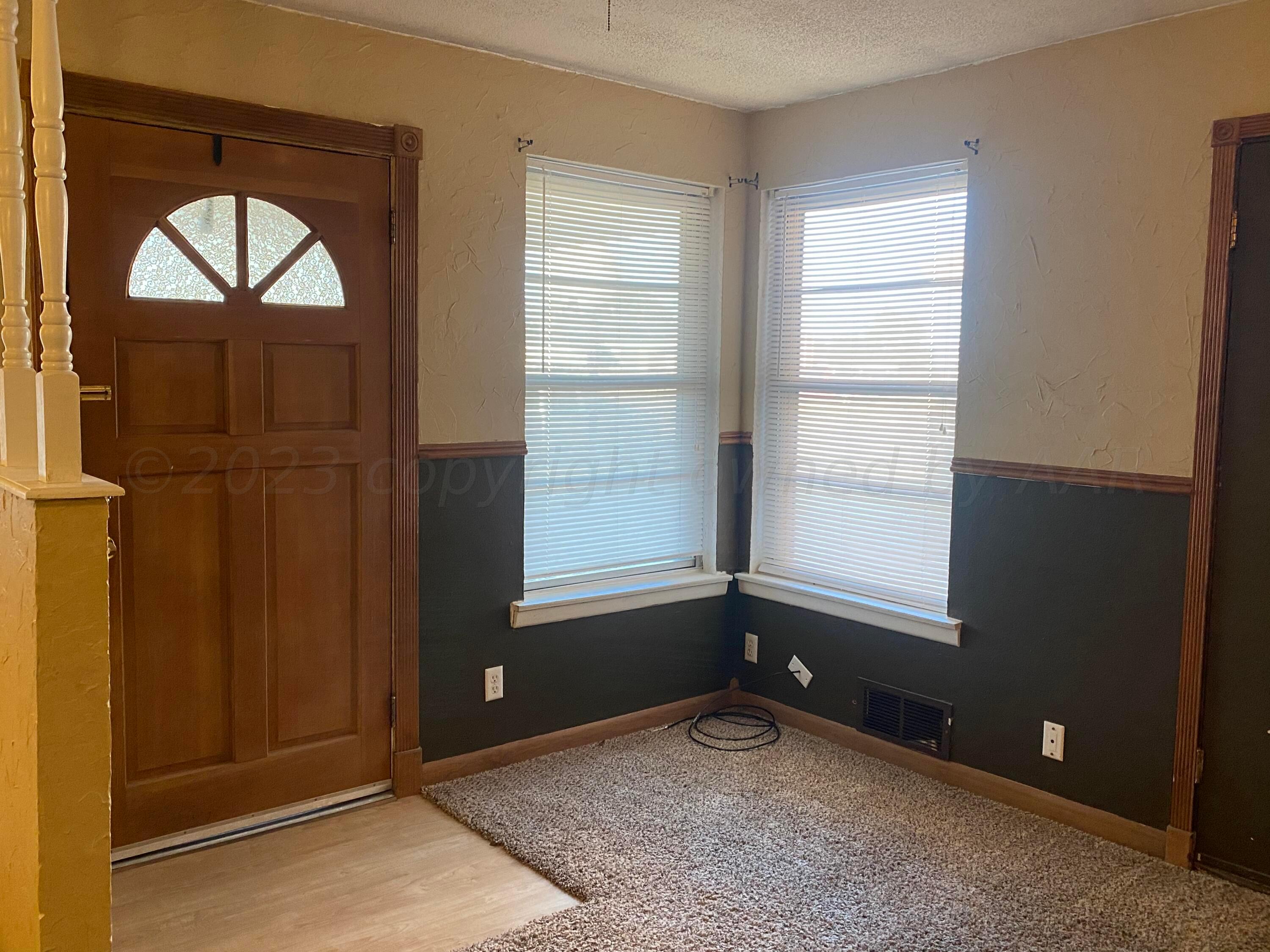 310 Santa Fe Street Borger, TX 79007 - Photo 1 of 18 an empty room with windows and closet