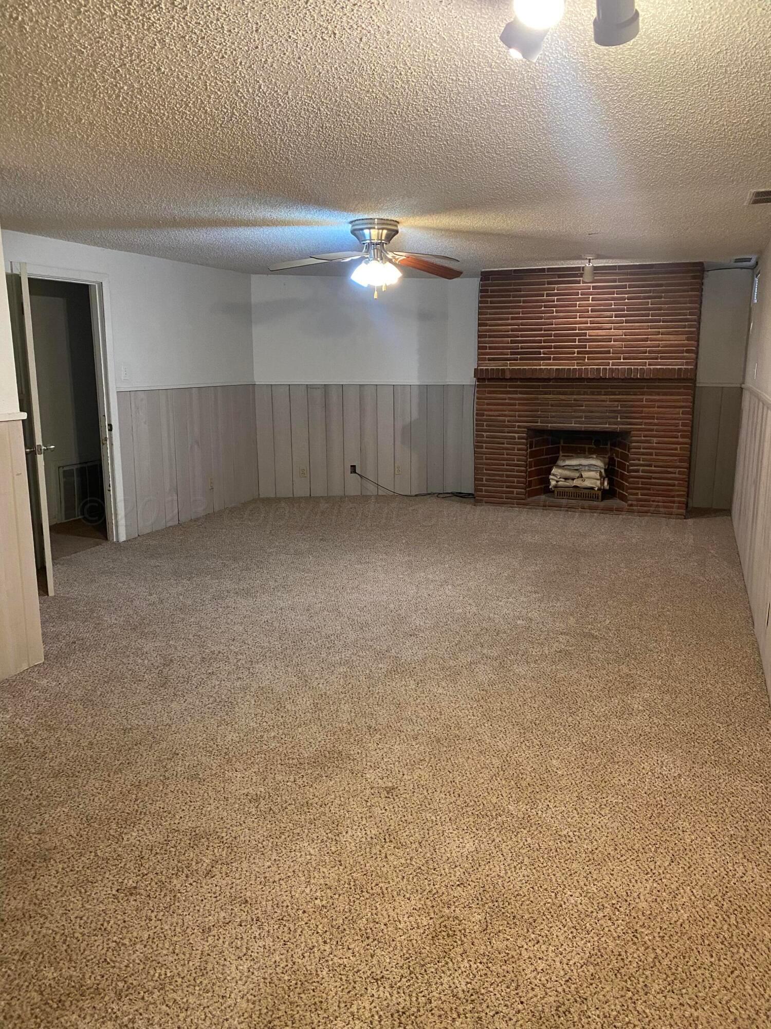 310 Santa Fe Street Borger, TX 79007 - Photo 13 of 18 a view of empty room with a fireplace