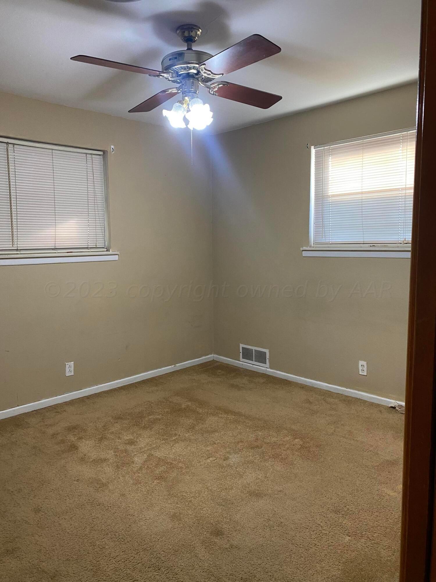310 Santa Fe Street Borger, TX 79007 - Photo 9 of 18 en view of an empty room with a window