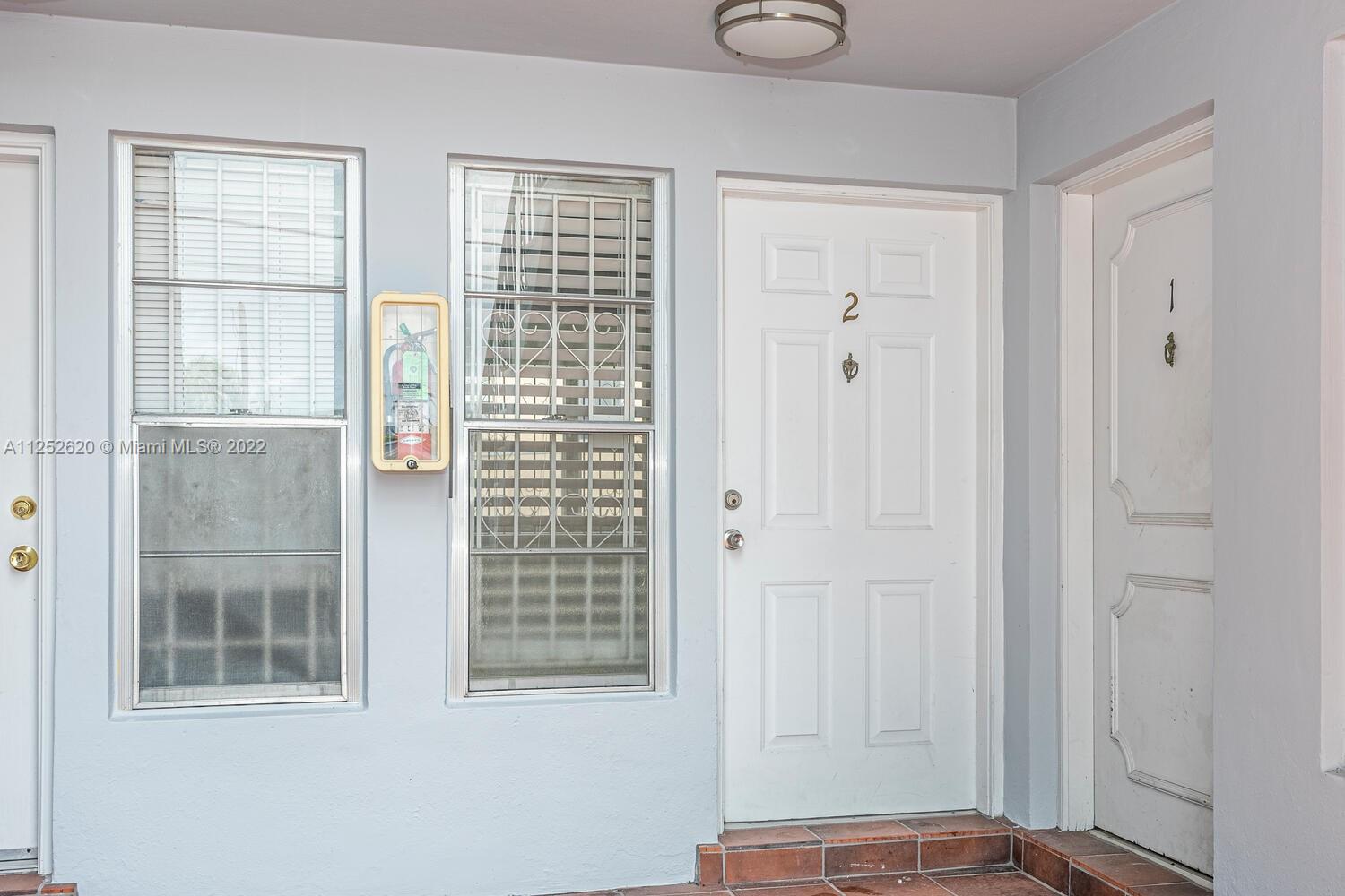 1390 Northwest 2nd Street, Unit 2 Miami, FL 33125 - Photo 2 of 10 a view of front door