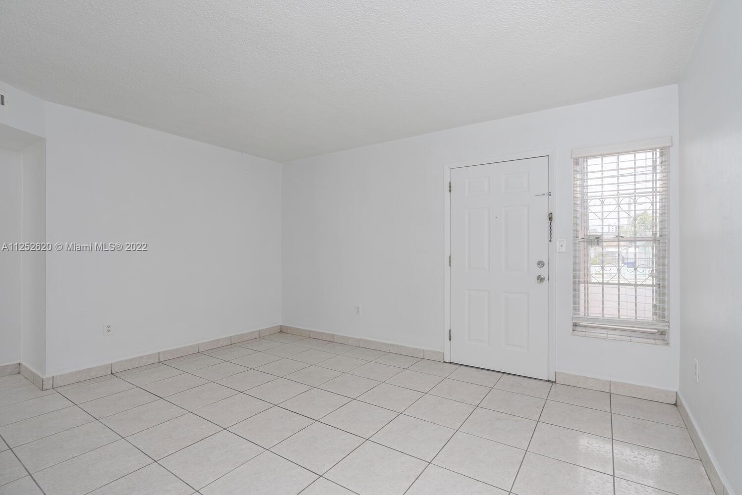 1390 Northwest 2nd Street, Unit 2 Miami, FL 33125 - Photo 3 of 10 an empty room with windows