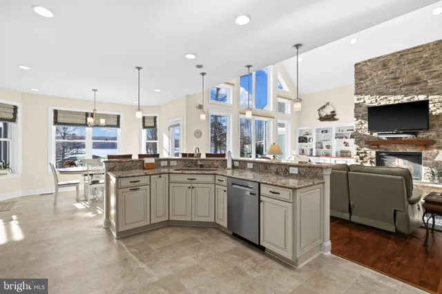 a view of a dining room with furniture and a window