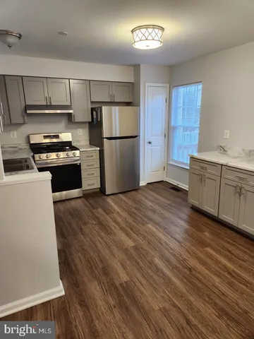 a bathroom with a sink toilet and vanity