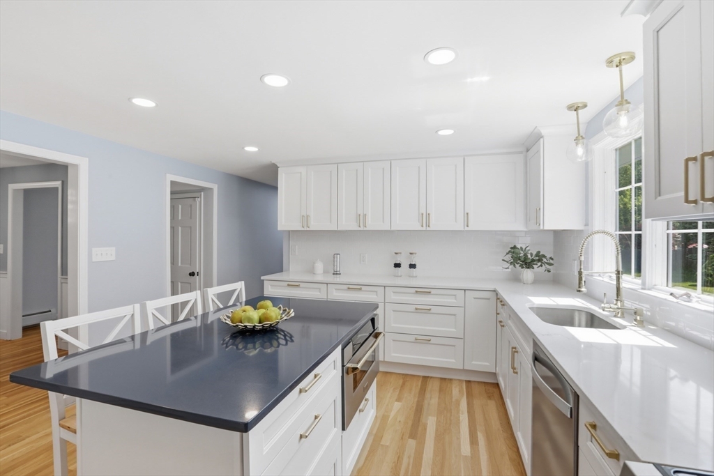 94 Johnson Road Winchester, MA 01890 - Photo 5 of 40 a kitchen with a sink stove and cabinets