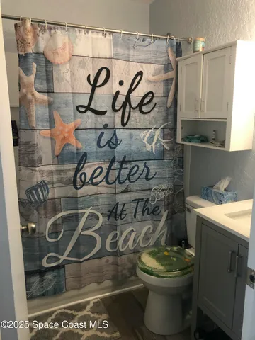 a bathroom with a toilet and a sink