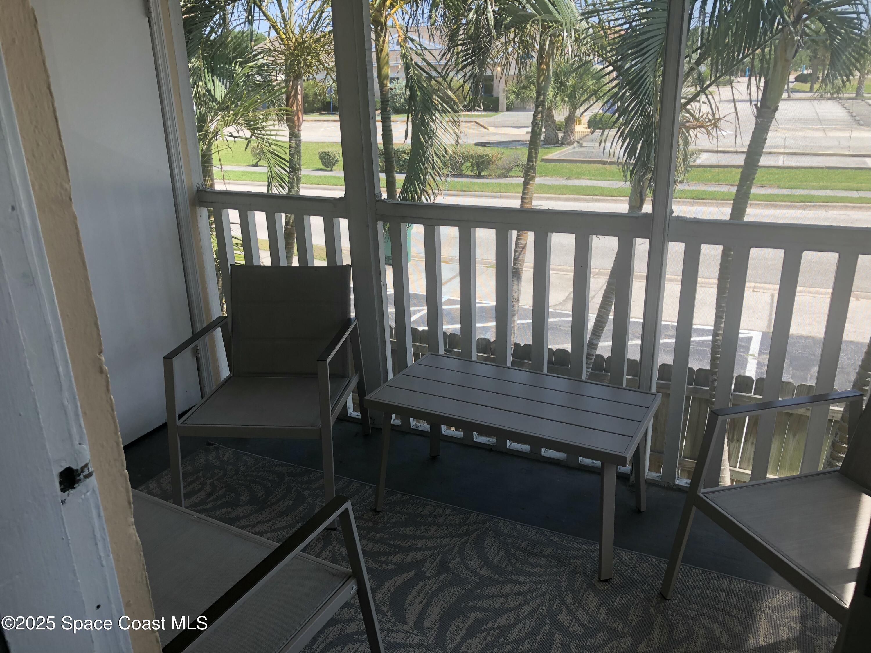 380 North Brevard Avenue, Unit C7 Cocoa Beach, FL 32931 - Photo 9 of 10 a view of a chairs in a balcony