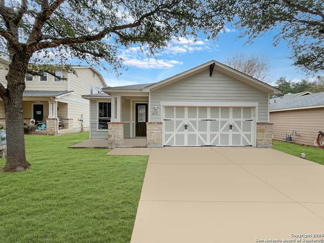 a view of a yard in front of house