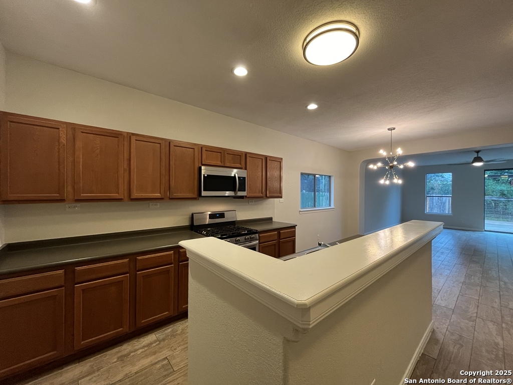 317 Sandy Shoal Boerne, TX 78006 - Photo 11 of 50 a kitchen with furniture a sink and a stove