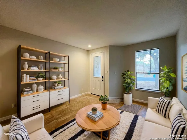 a living room with furniture and a window