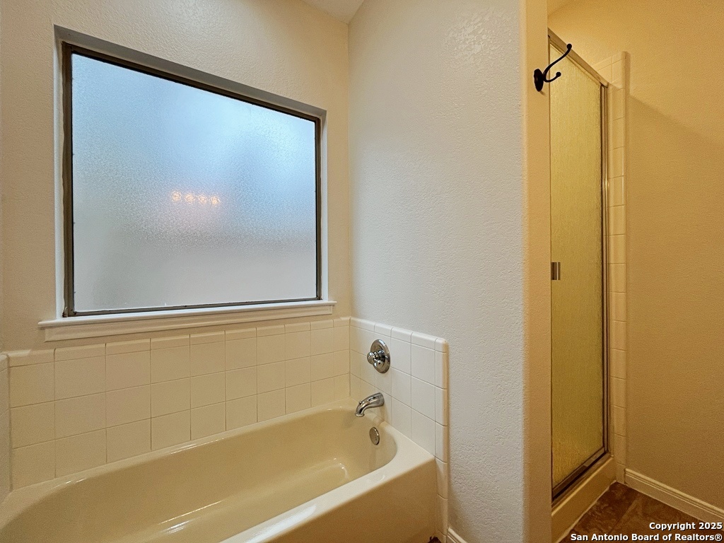 317 Sandy Shoal Boerne, TX 78006 - Photo 21 of 50 a bathroom with a bathtub and shower