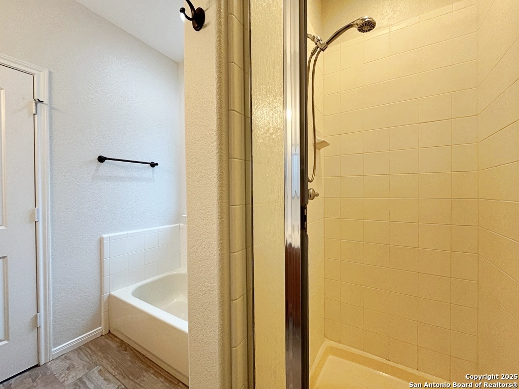 317 Sandy Shoal Boerne, TX 78006 - Photo 22 of 50 a bathroom with a tub and shower