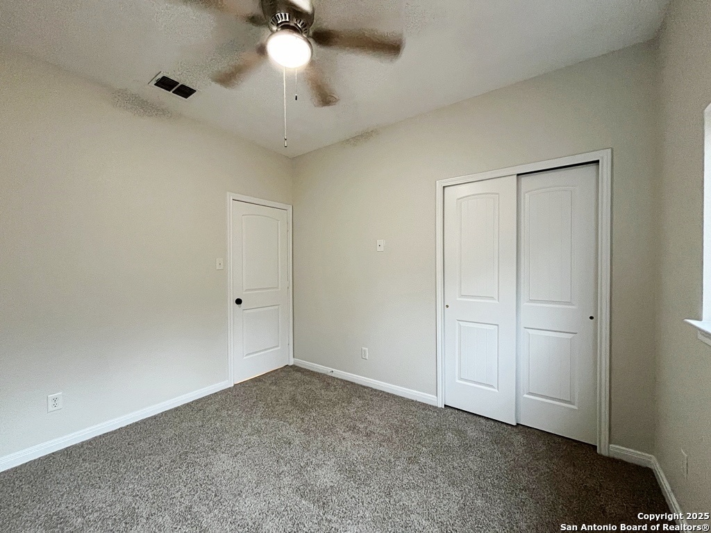 317 Sandy Shoal Boerne, TX 78006 - Photo 29 of 50 a view of an empty room and a ceiling fan