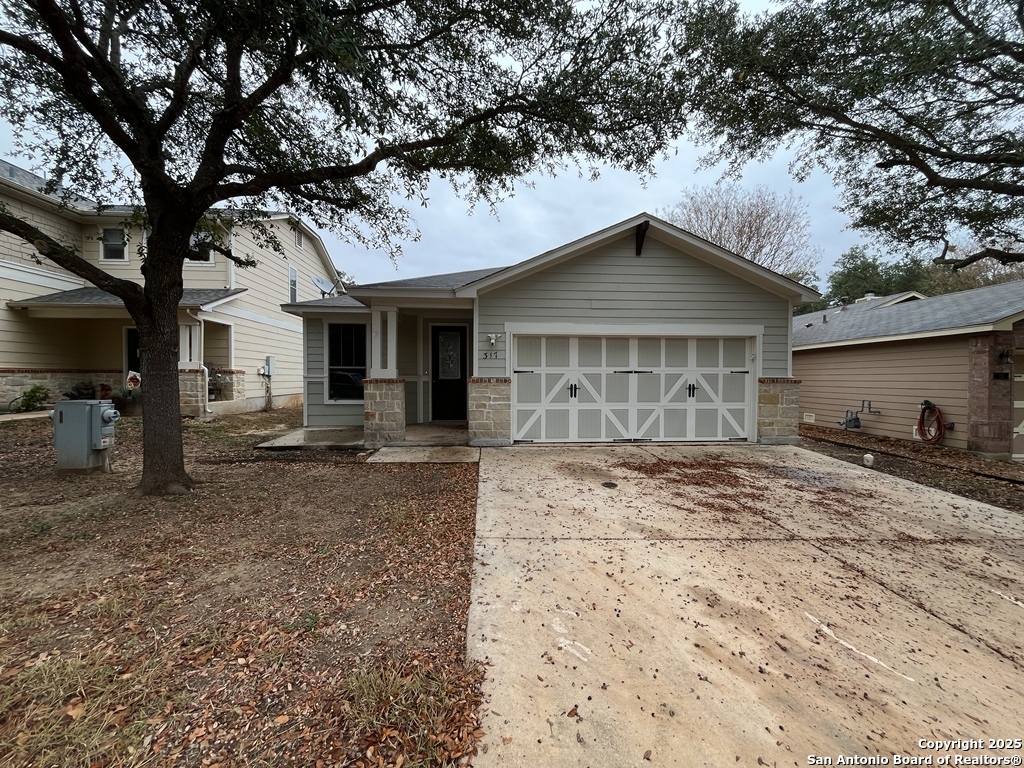 317 Sandy Shoal Boerne, TX 78006 - Photo 35 of 50 a front view of a house with garden