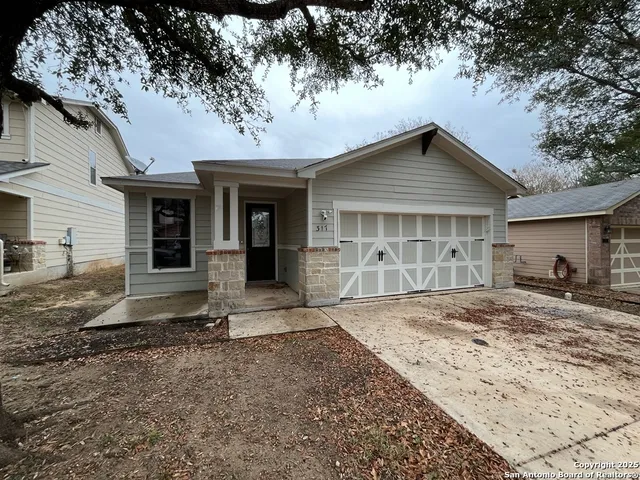 an aerial view of residential house with outdoor space and swimming pool