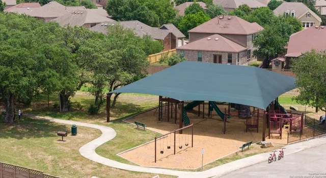 a view of a swimming pool with a patio