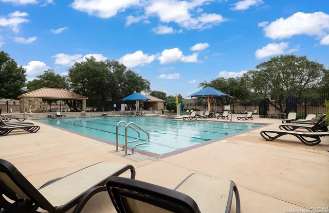 swimming pool view with sitting space