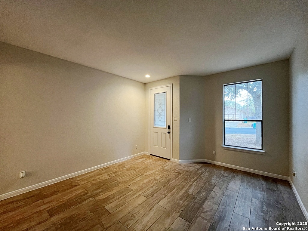 317 Sandy Shoal Boerne, TX 78006 - Photo 10 of 50 an empty room with wooden floor and windows
