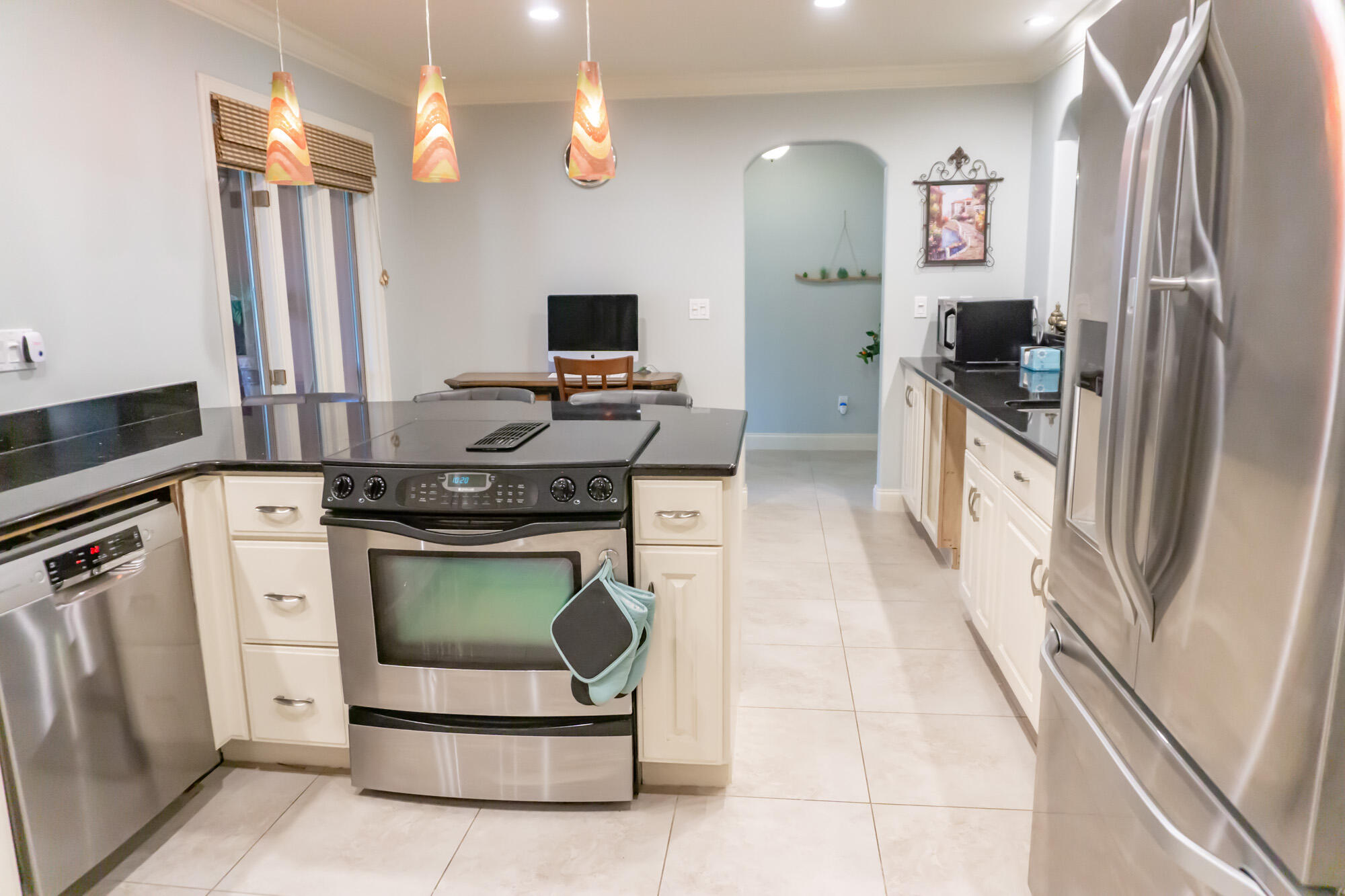 372 Golfview Drive Miramar Beach, FL 32550 - Photo 15 of 66 a kitchen with stainless steel appliances granite countertop a stove a sink and a refrigerator