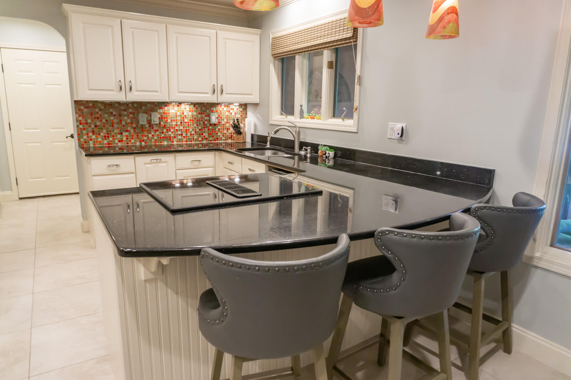 372 Golfview Drive Miramar Beach, FL 32550 - Photo 18 of 66 a kitchen with a table chairs and a sink