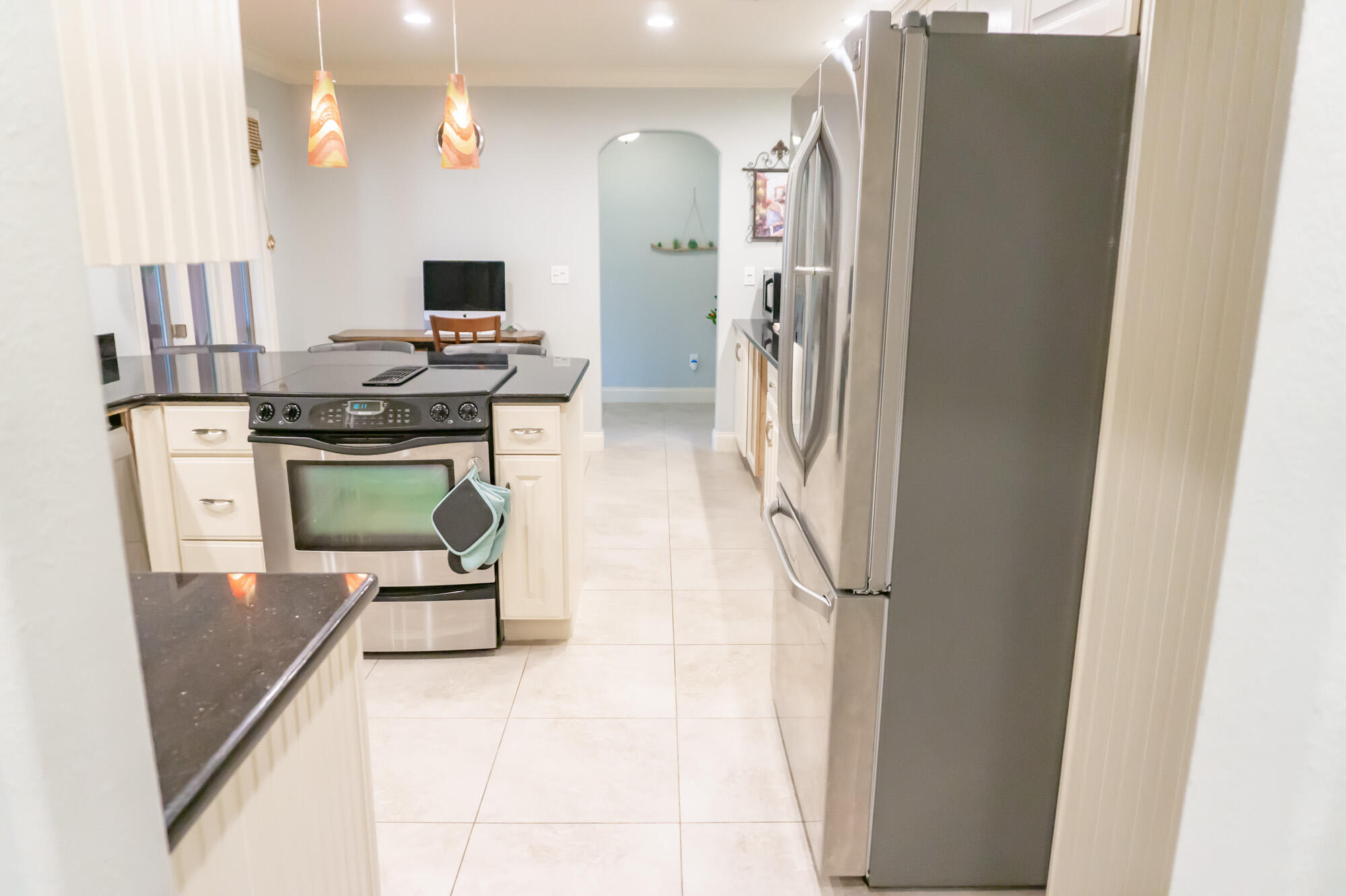 372 Golfview Drive Miramar Beach, FL 32550 - Photo 19 of 66 a kitchen with stainless steel appliances granite countertop a refrigerator and a stove