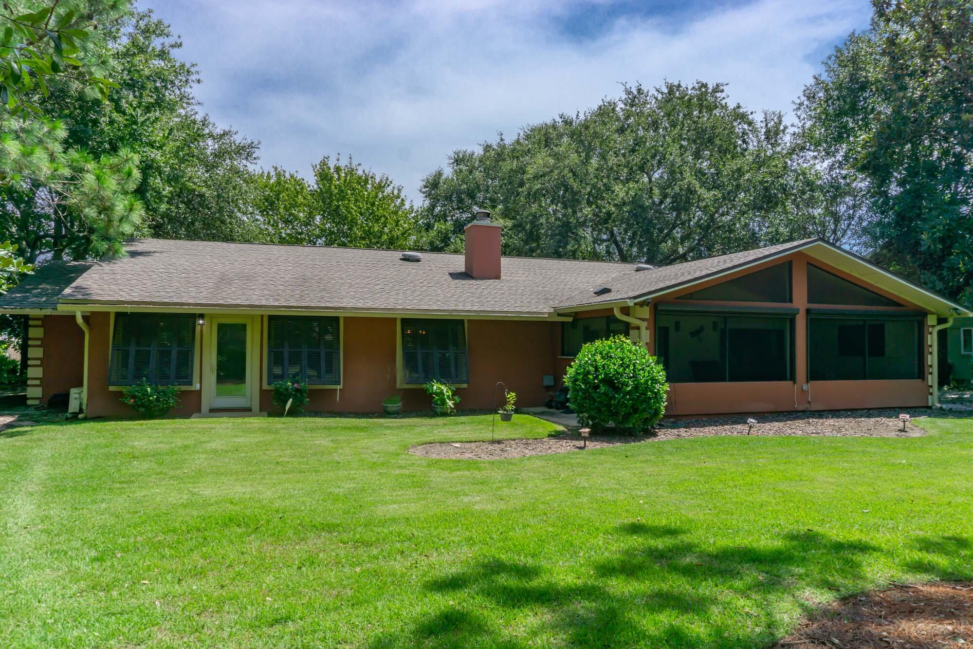 372 Golfview Drive Miramar Beach, FL 32550 - Photo 2 of 66 a front view of a house with a yard