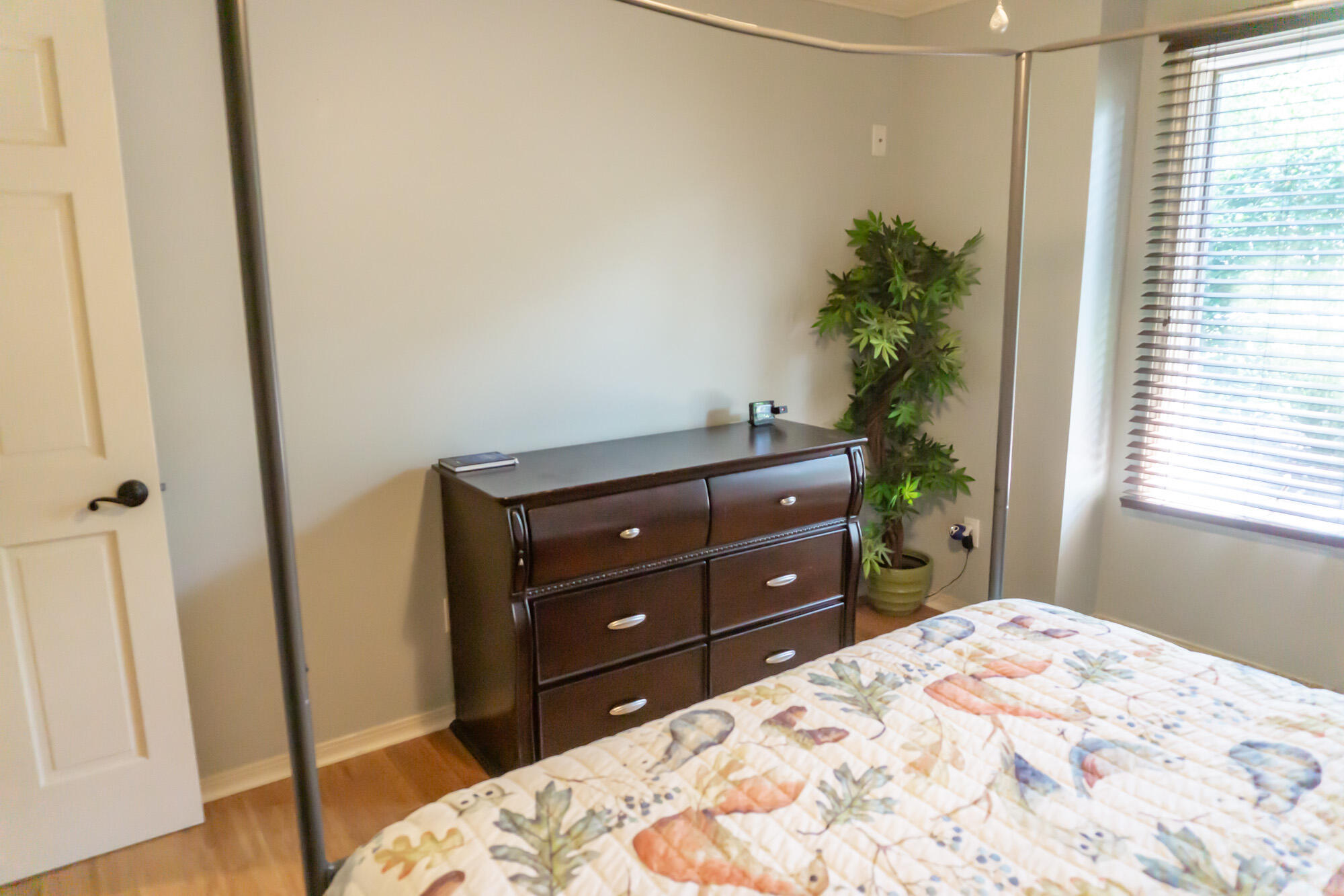 372 Golfview Drive Miramar Beach, FL 32550 - Photo 49 of 66 a bedroom with a bed and a potted plant