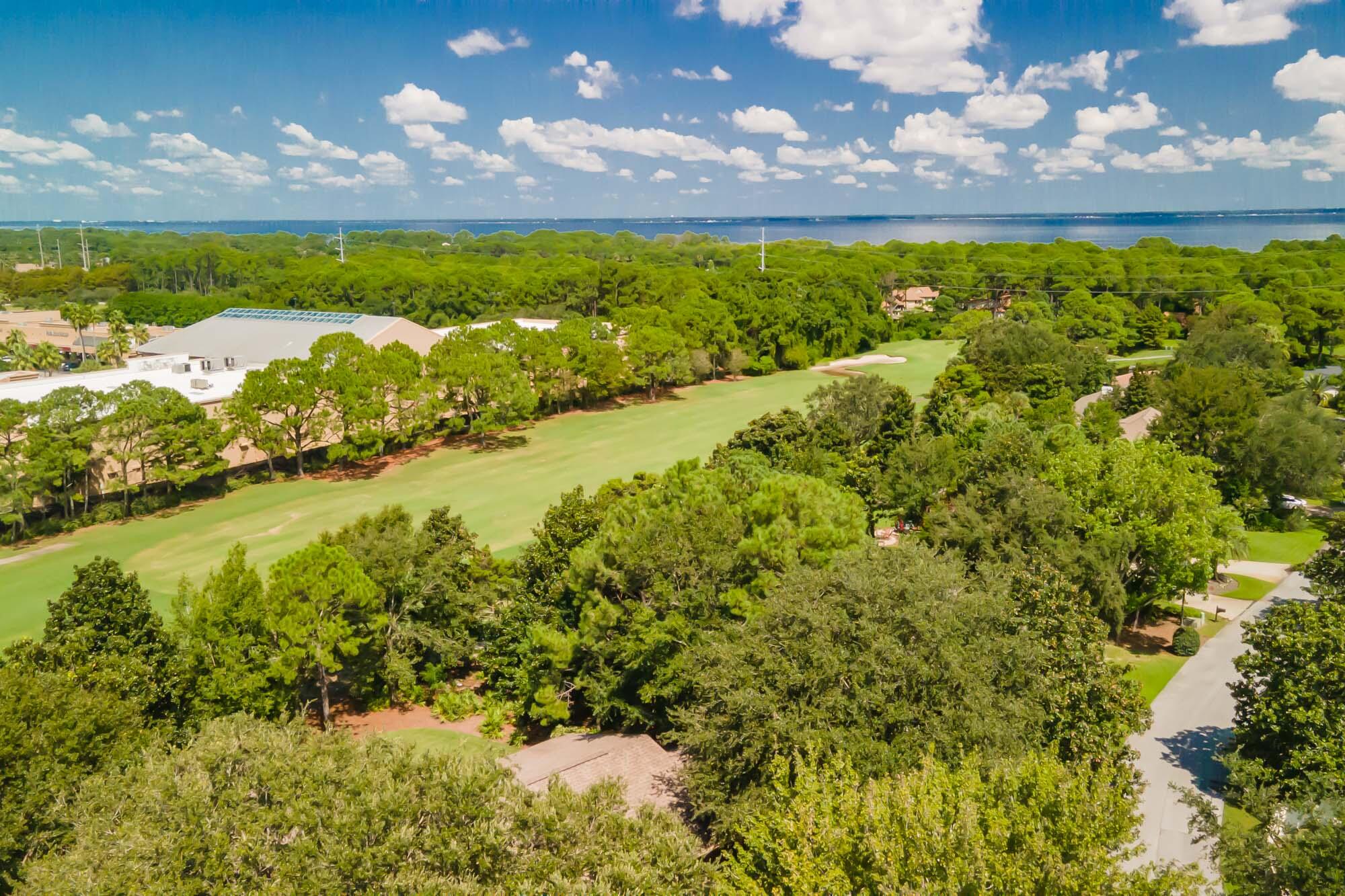372 Golfview Drive Miramar Beach, FL 32550 - Photo 59 of 66 a view of a lake with a building in the background