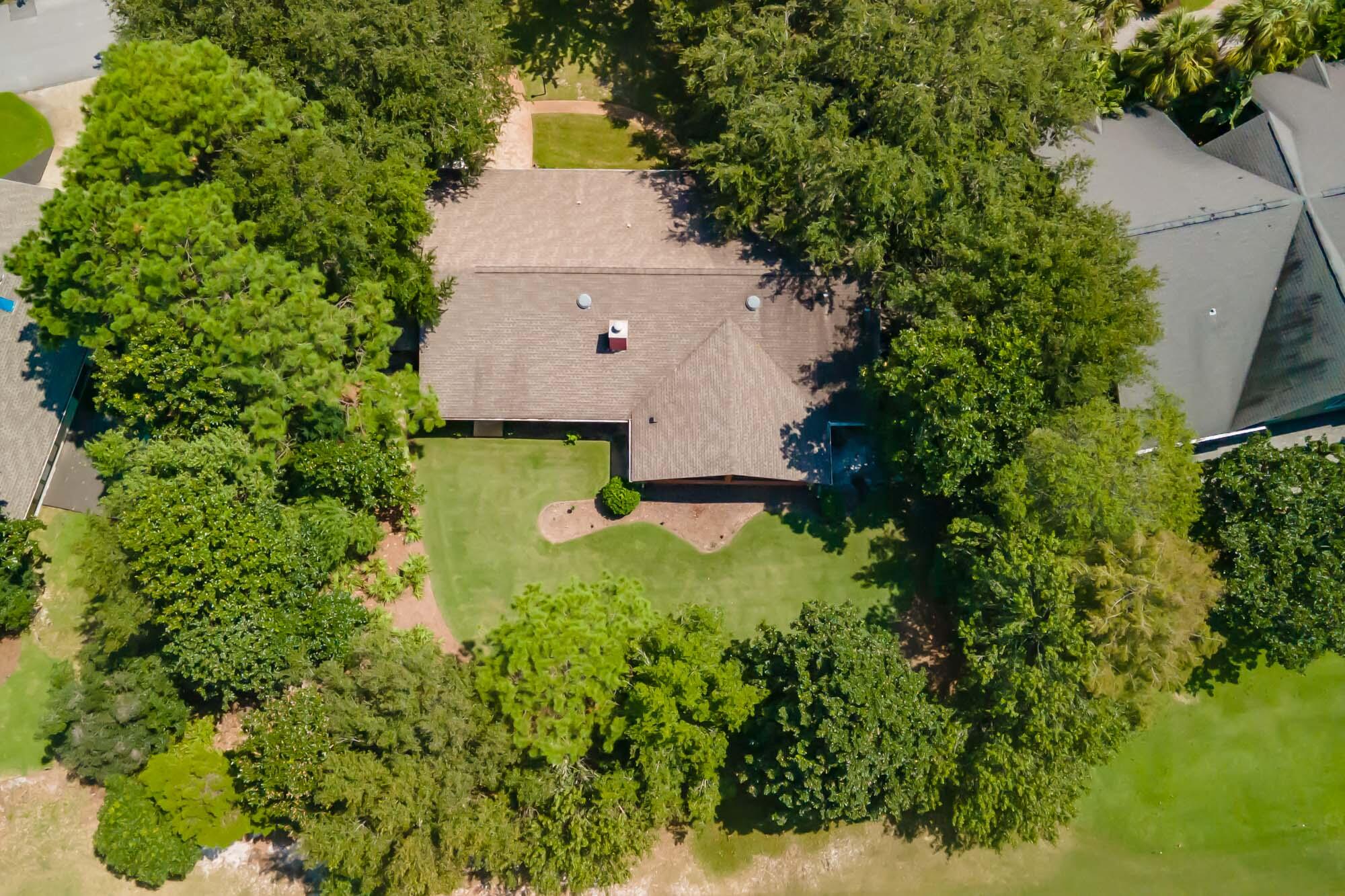372 Golfview Drive Miramar Beach, FL 32550 - Photo 64 of 66 an aerial view of a house with a yard and lake view