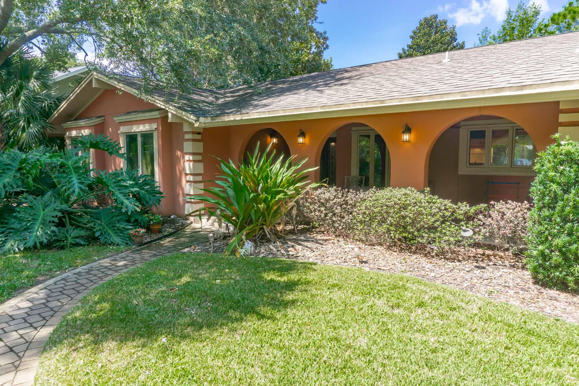 372 Golfview Drive Miramar Beach, FL 32550 - Photo 8 of 66 a front view of a house with garden
