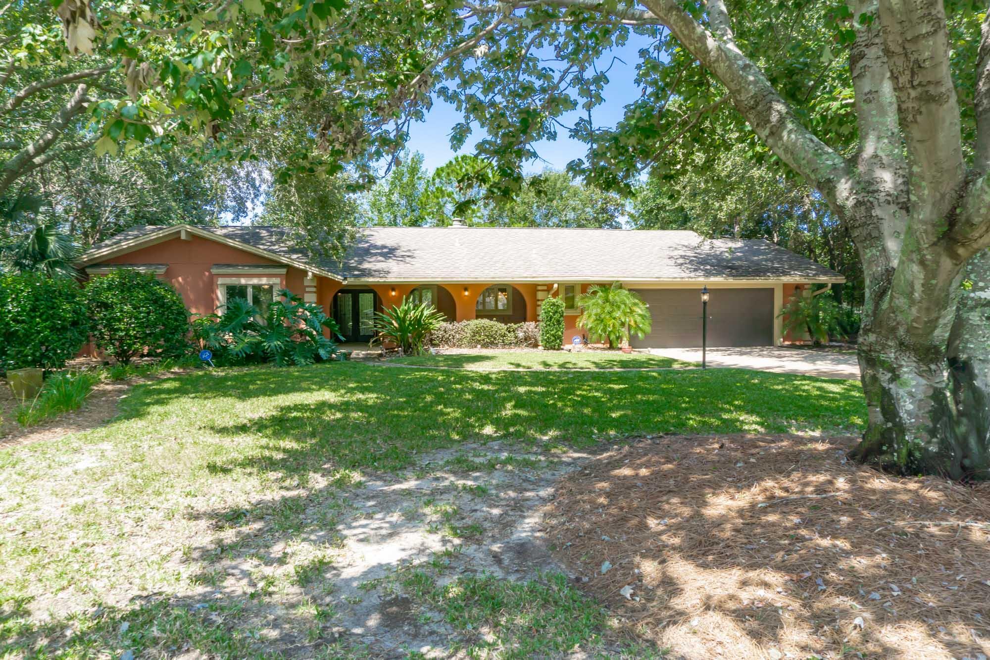 372 Golfview Drive Miramar Beach, FL 32550 - Photo 9 of 66 a front view of a house with garden