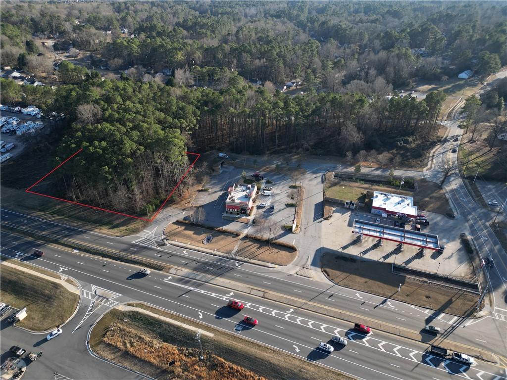 3030 Jim Owens Road Northwest Kennesaw, GA 30152 - Photo 8 of 9 an aerial view of a residential apartment building with parking