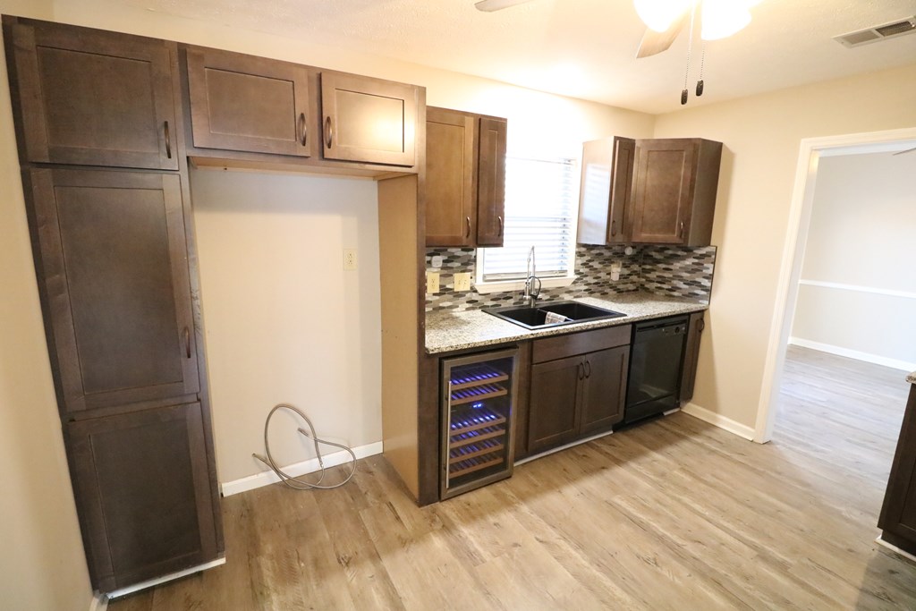 7 Primrose Court Columbus, GA 31907 - Photo 12 of 37 a kitchen with stainless steel appliances granite countertop a refrigerator stove and sink