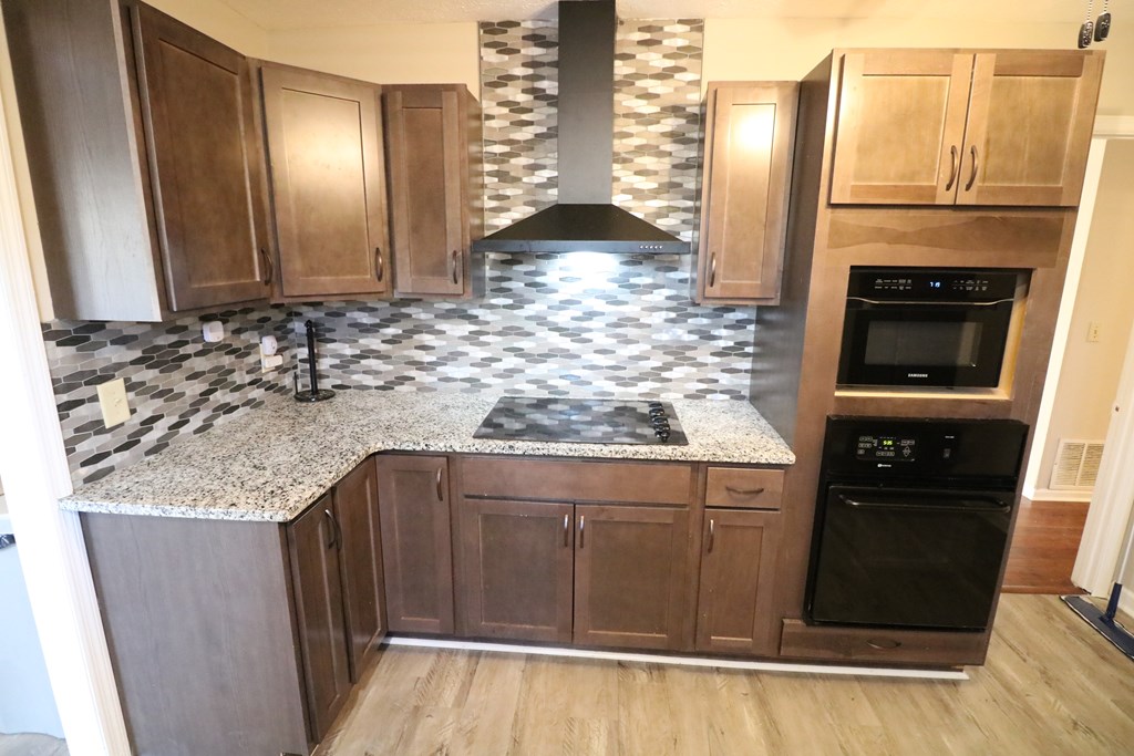 7 Primrose Court Columbus, GA 31907 - Photo 13 of 37 a kitchen with granite countertop a sink and a stove